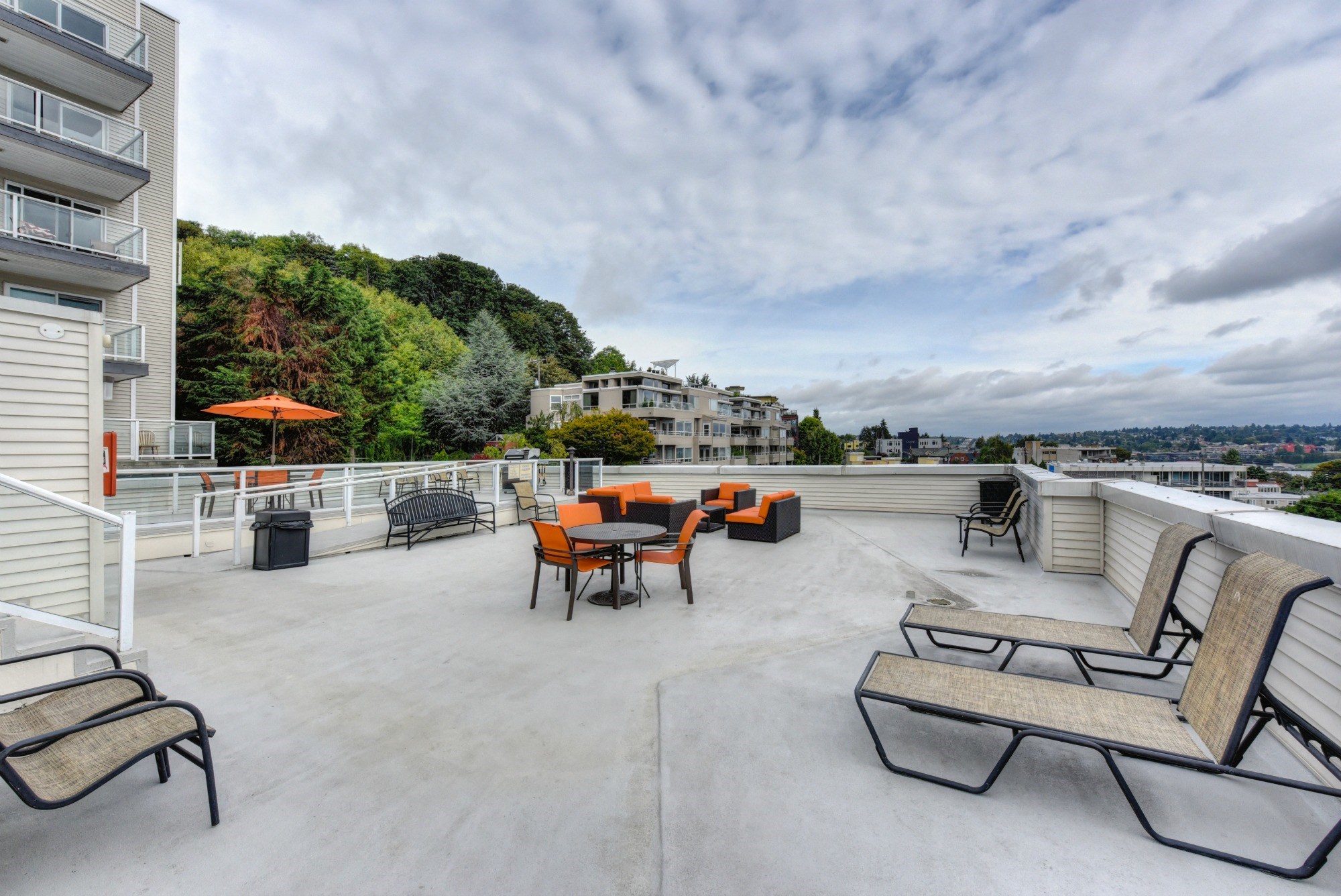 Rooftop Lounge with Lounge Chairs, Orange Chairs and Trees